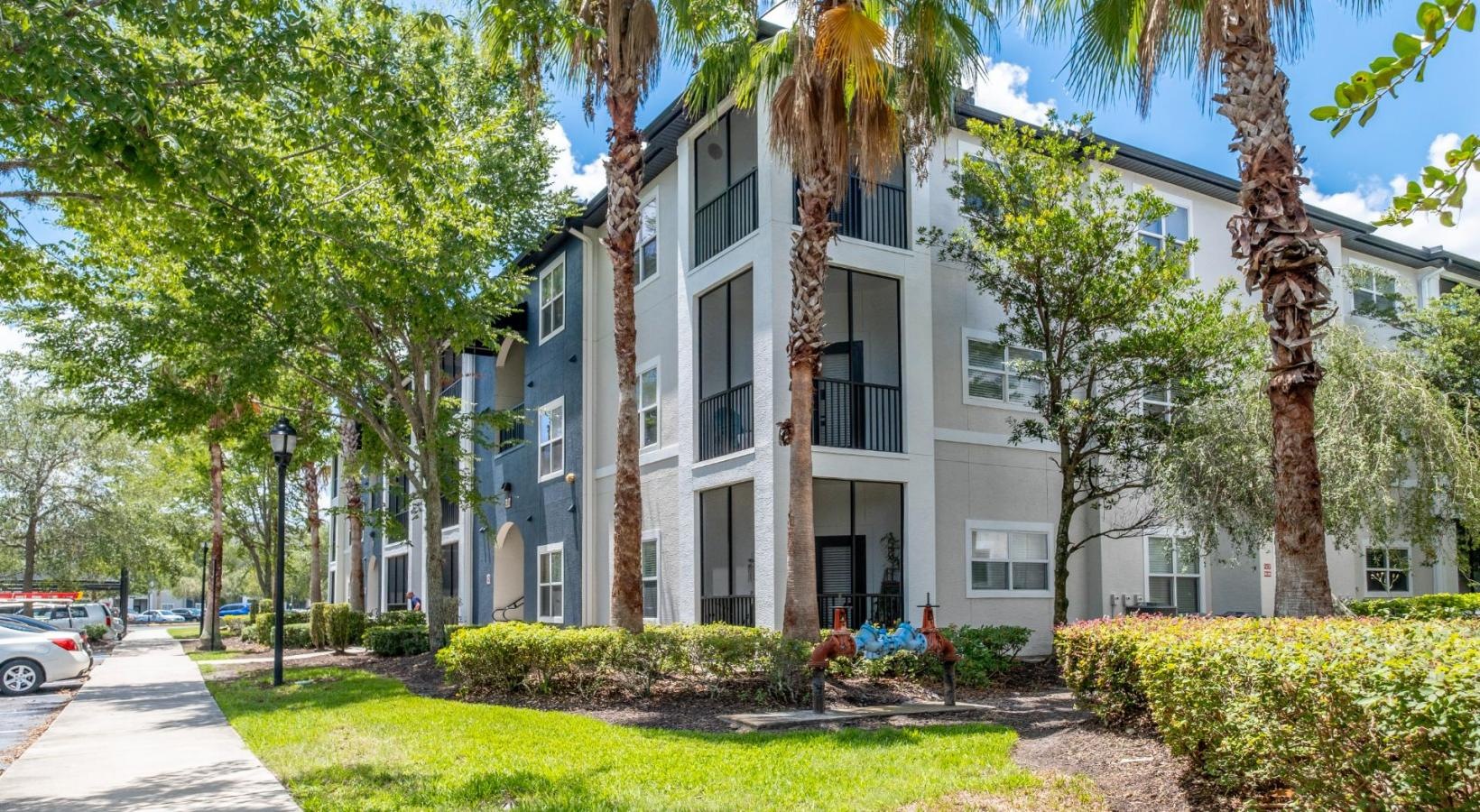 Find your perfect fit at Verano a building with trees and grass