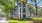 a building with trees and grass