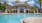 a pool in front of a house