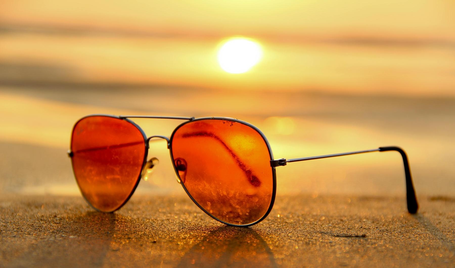 The essence of exceptional living a pair of sunglasses on a beach