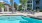 a pool with chairs around it