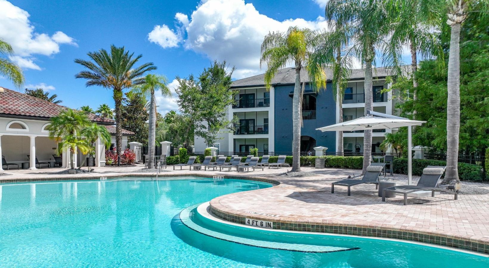 Shimmering resort-style pool a pool in front of a building