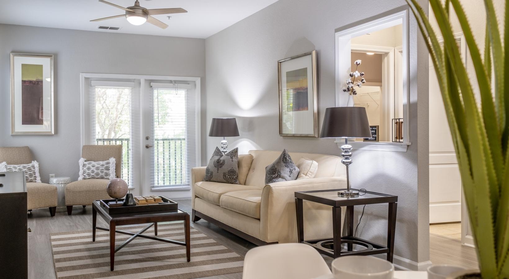 Spacious living areas to recline and recharge a living room with a couch and a table