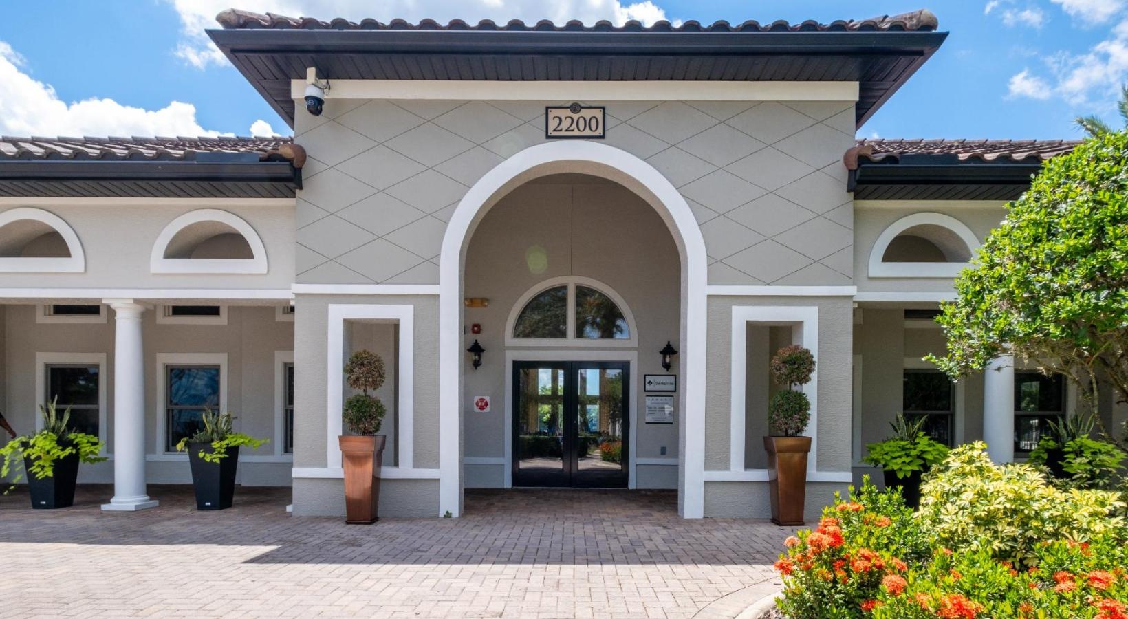 Find your perfect fit at Verano a building with a brick walkway