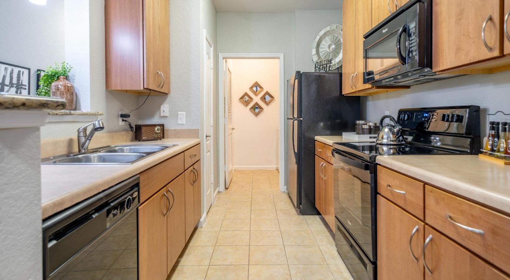 Spacious kitchens with thoughtful details a kitchen with wooden cabinets