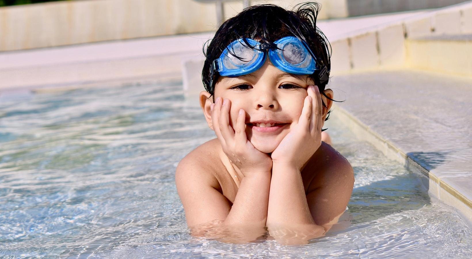 Sparkling swimming pool a child in a pool