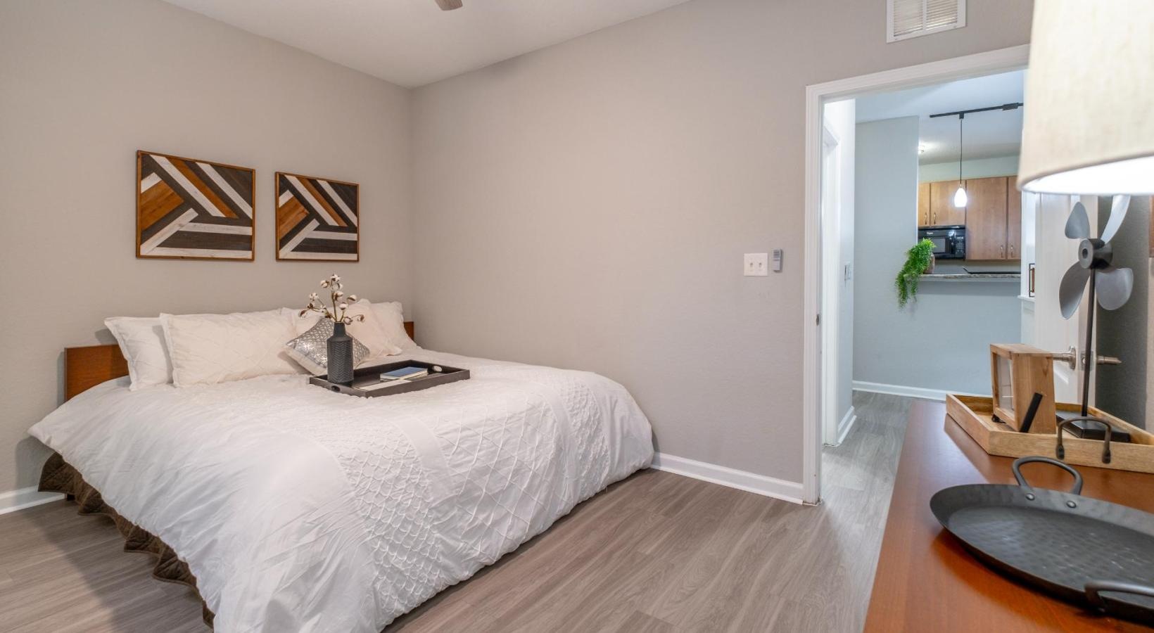 Generous bedroom offerings to fit every family a bedroom with a bed and a fan