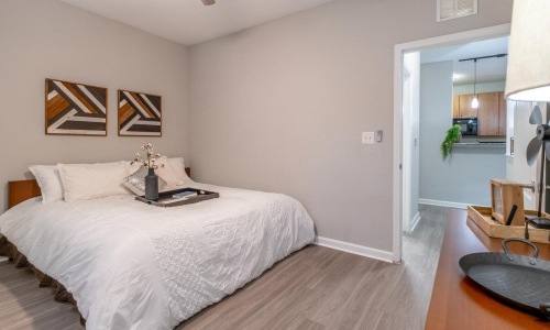 Generous bedroom offerings to fit every family a bedroom with a bed and a fan