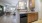 a kitchen with wooden cabinets